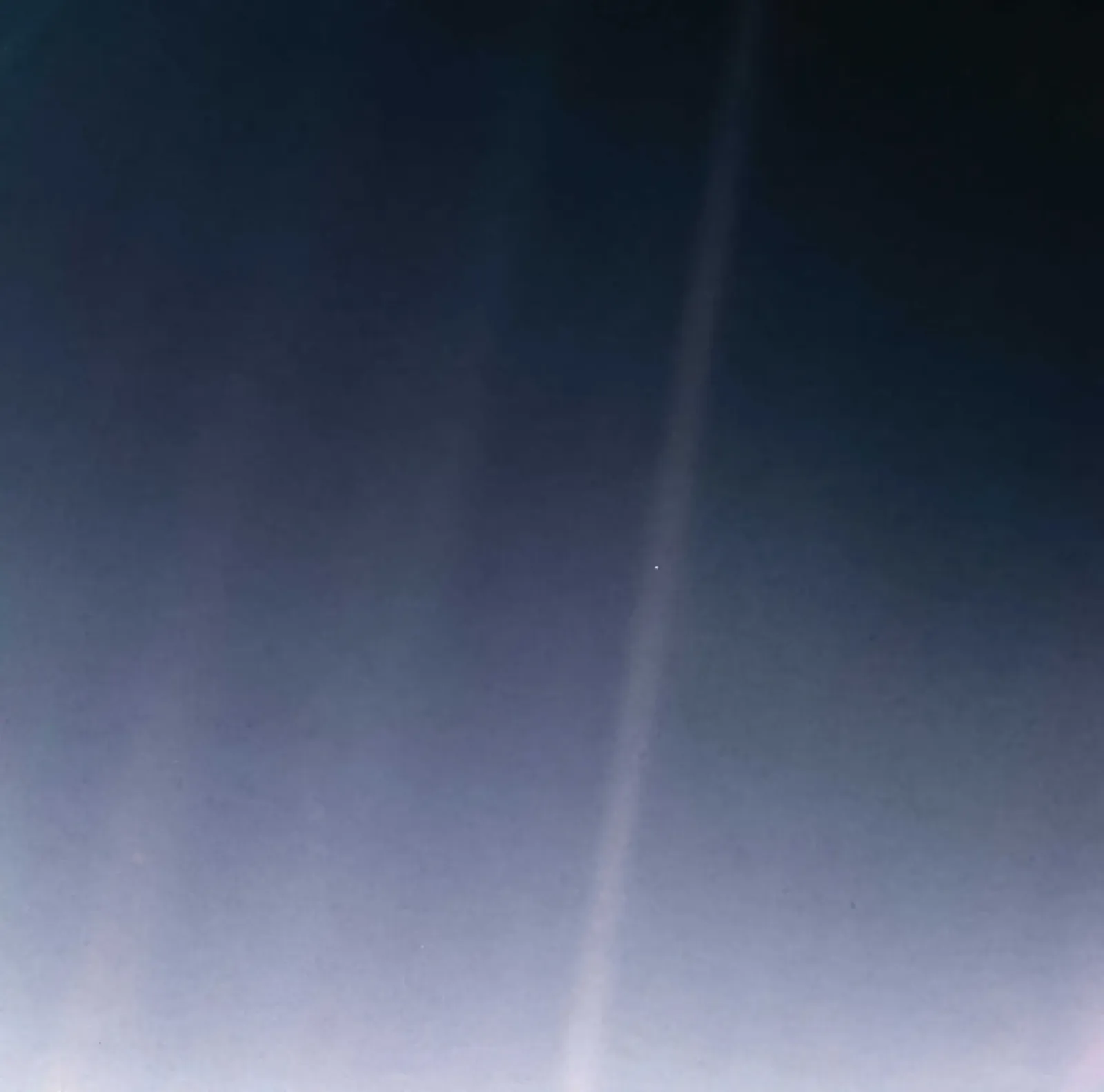 Earth as a tiny pale blue dot, photographed by Voyager 1 from 3.7 billion miles away